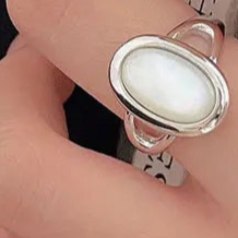 White shell and silver ring